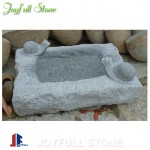 Carved stone birdbath for garden and landscape