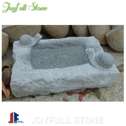 Carved stone birdbath for garden and landscape