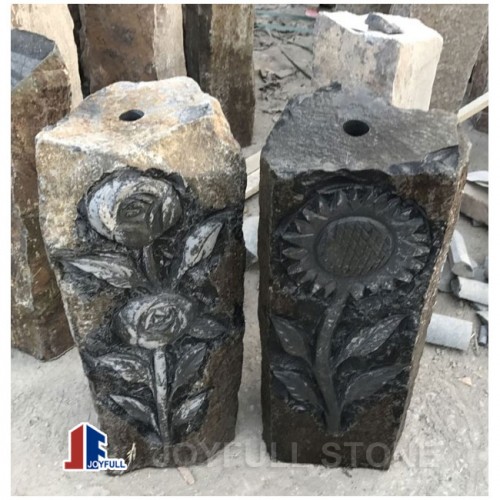 Black basalt pillar water fountain with flower carvings