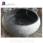Round stone sinks with rough rustic surface