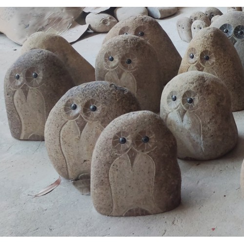 Medium size carved brown river stone owls